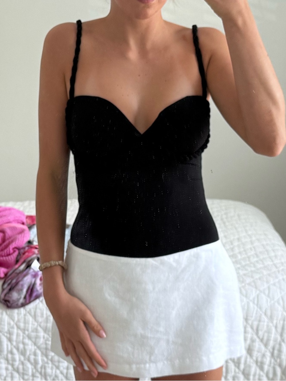 Black bodysuit with roping detail and built in cups